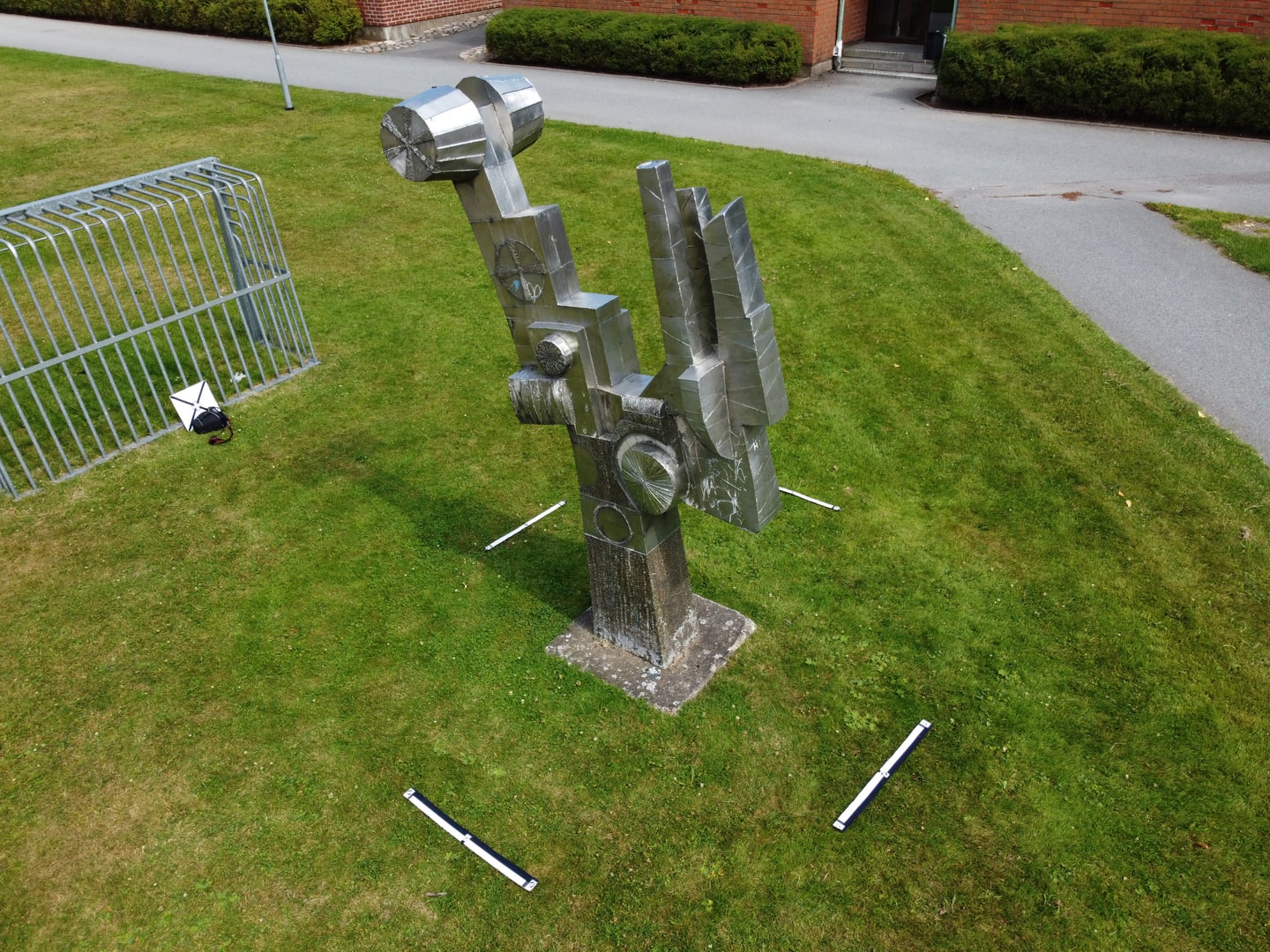Reference photo from a photogrammetry capture set for a small metal sculpture.