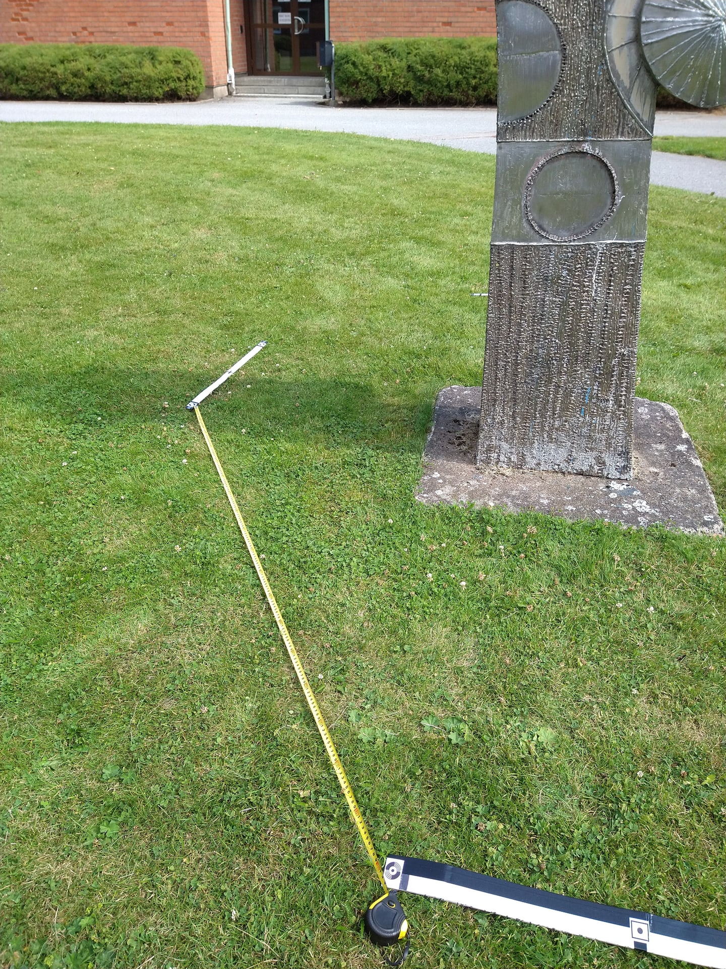 Reference photo from a photogrammetry capture set for a small metal sculpture.